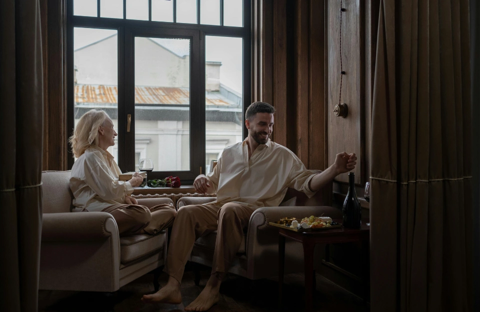 older woman and younger man in conversation representing the generational friendship at the heart of Remarkably Bright Creatures