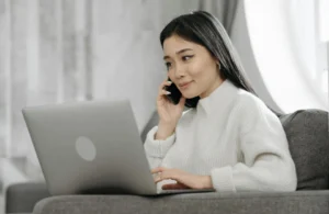 Girl with laptop and Phone — setting for working from home