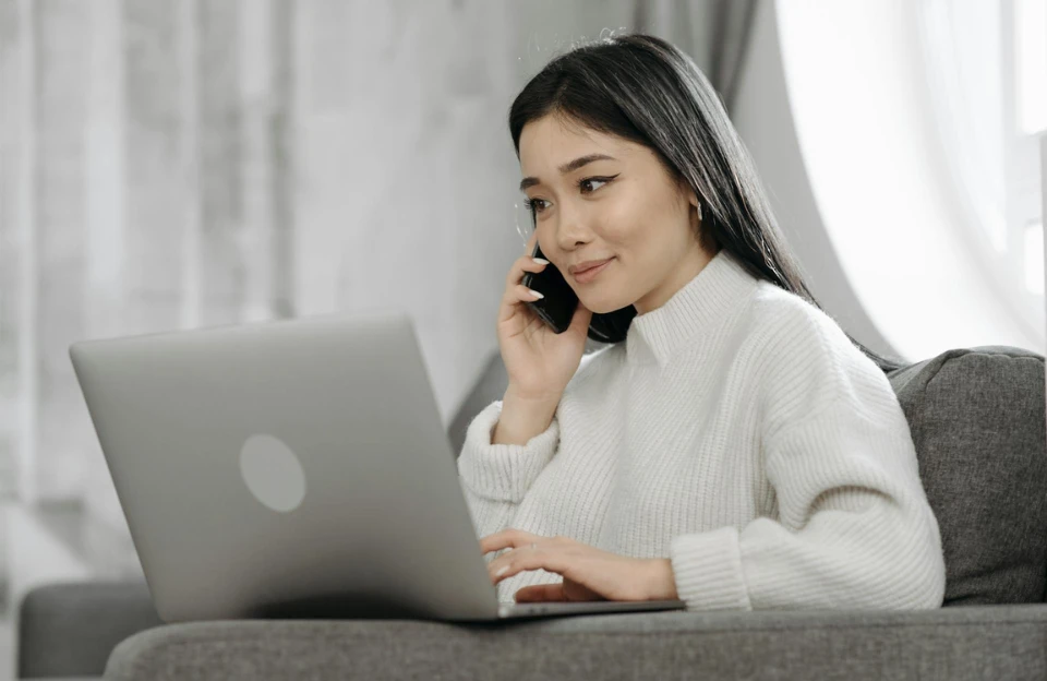 Girl with laptop and Phone — setting for working from home