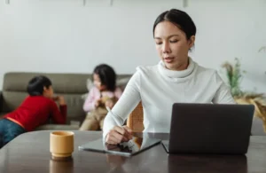 Working Mom doing work with kids